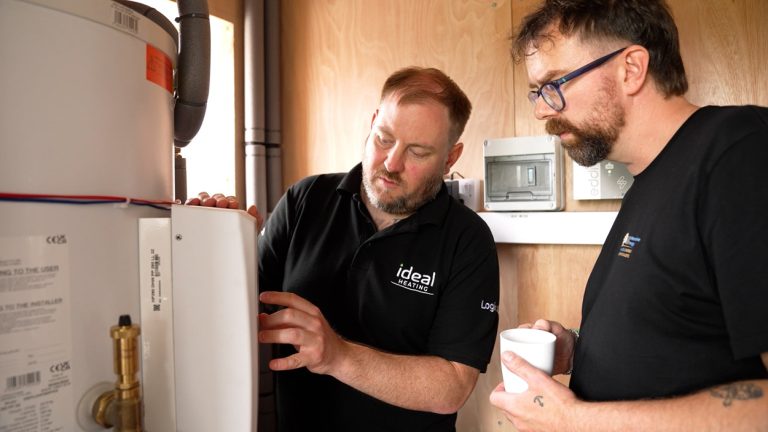 Ideal Heating Technical Sales Manager Tom Batten, left, supports Dan Cadd, Installations Manager at UK Alternative Energy, during an installation.